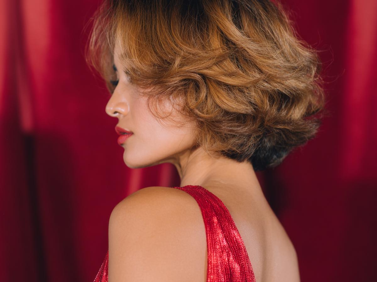 Voluminous Caramel Curly Bob
